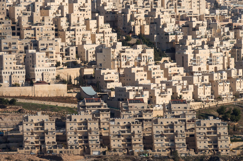 Apartment buildings cover a hillside