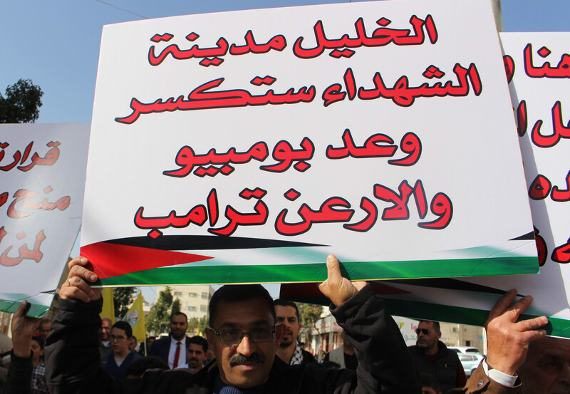 Man holds banner