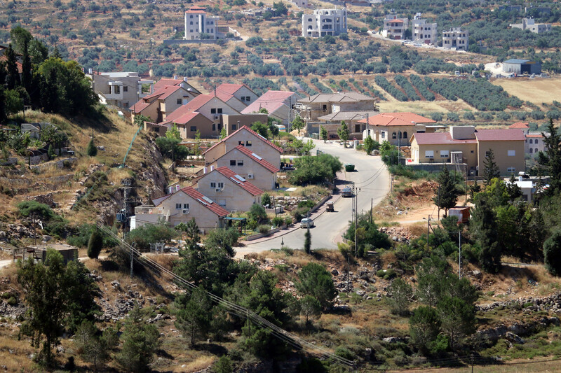 Landscape view of uniform homes along curving road
