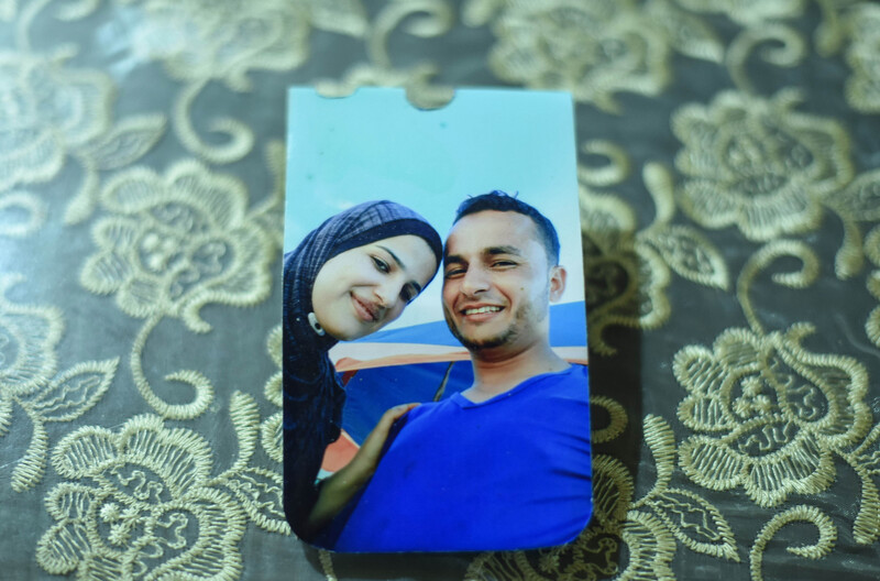 A color photo of a smiling couple lies on a table