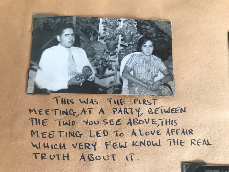 Photograph of young man sitting next to young woman with English-languag hand writing underneath