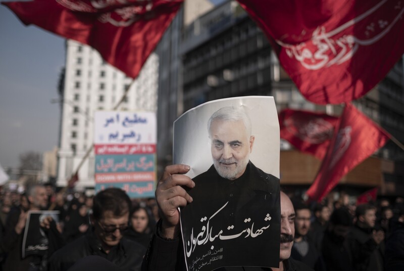 People demonstrate with flags and posters