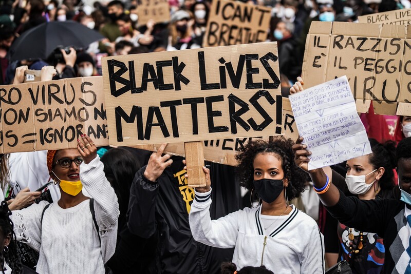 People hold signs