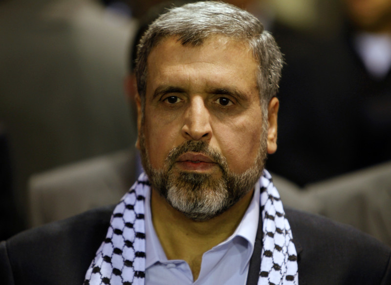 Man wears Palestinian scarf around his neck