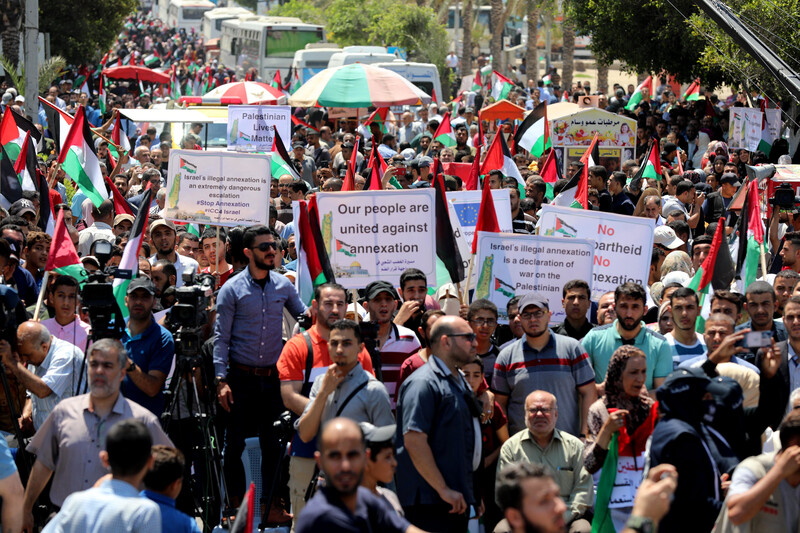 People march with placards and flags