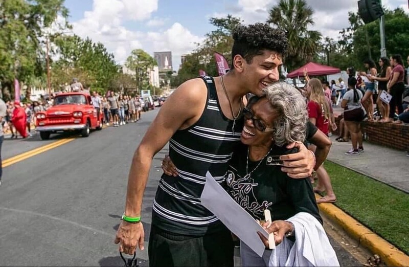 A man hugs a woman