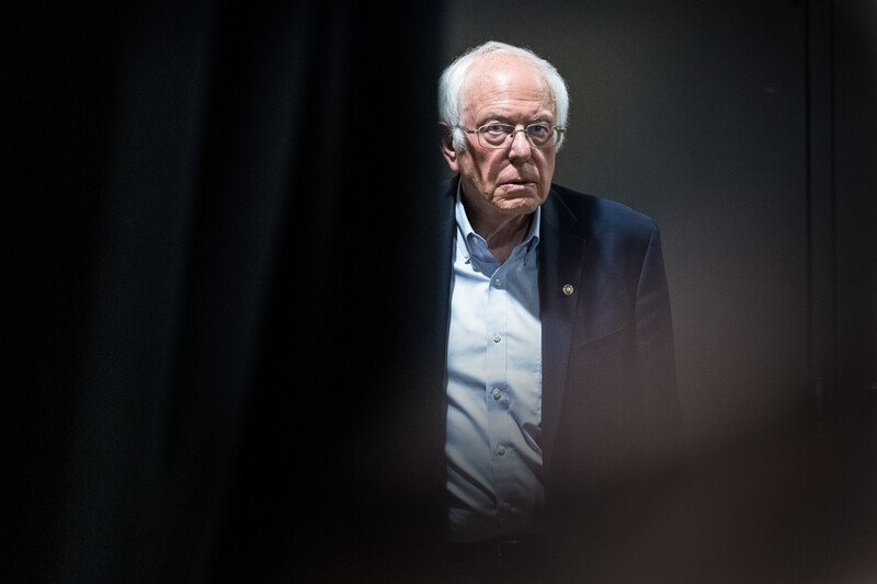 Man emerges from behind a curtain