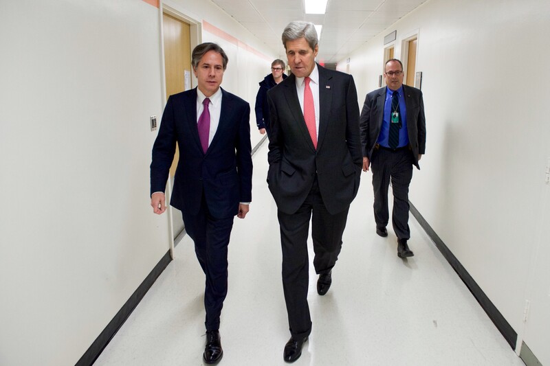 Men walking in hallway