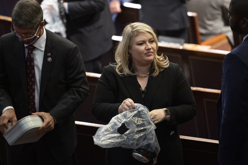 Man and woman prepare protective gear