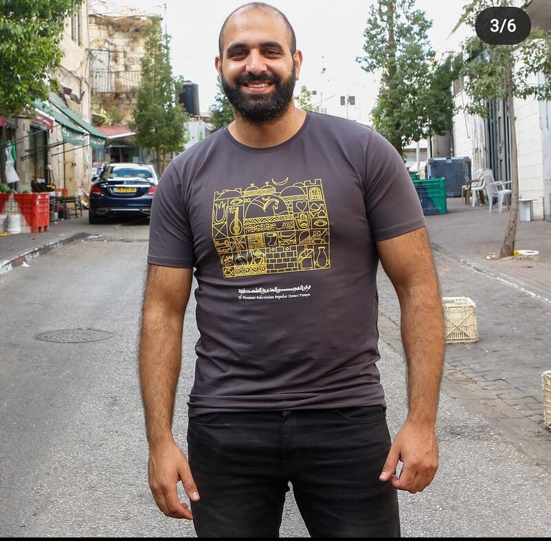 A man smiles at the camera