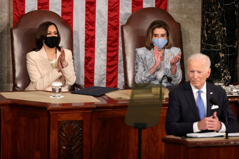 Harris and Pelosi applaud Biden