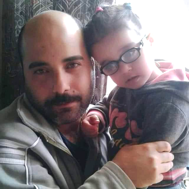 A man embraces a child