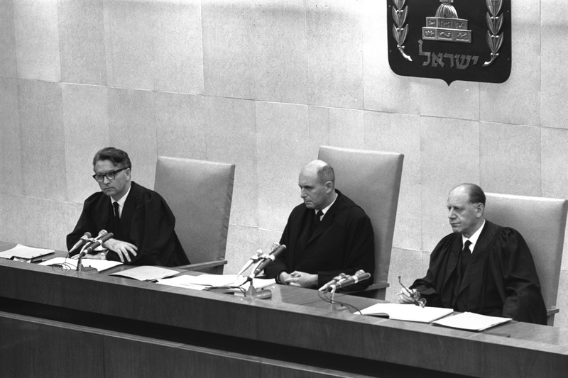 Three judges sit in an Israeli court