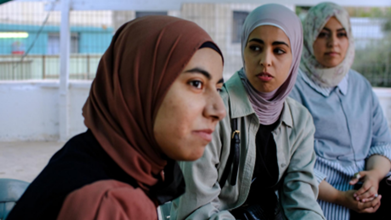 Three women sitting together 