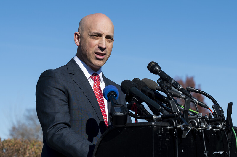 Jonathan Greenblatt speaks into several microphones