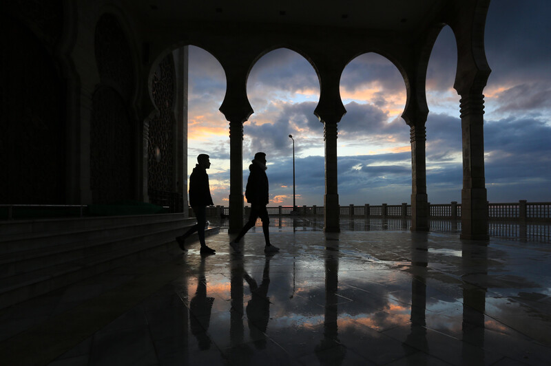 The arches of a mosque are silhouetted against a brooding winter sky over Gaza's beachfront.