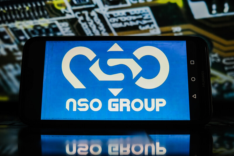 A phone is displaying NSO Group's logo 