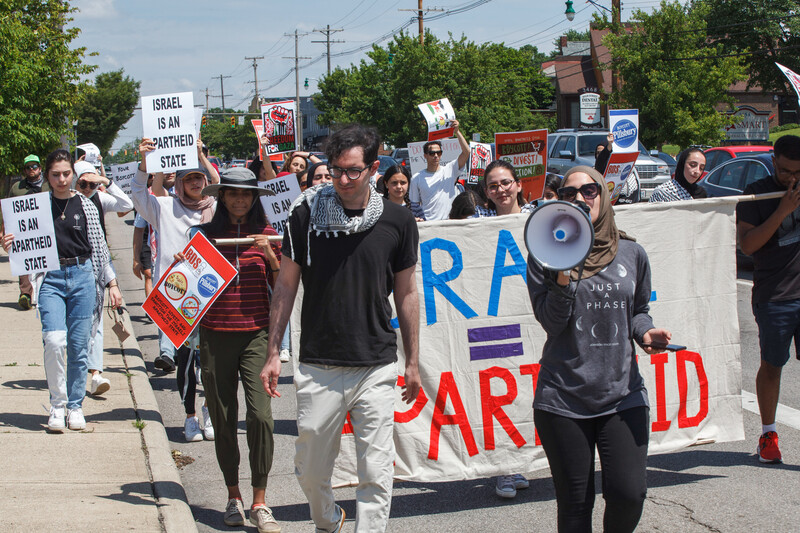 People march and carry signs