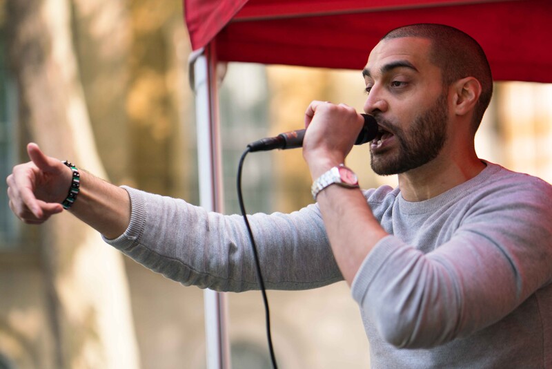 A man talks into a microphone