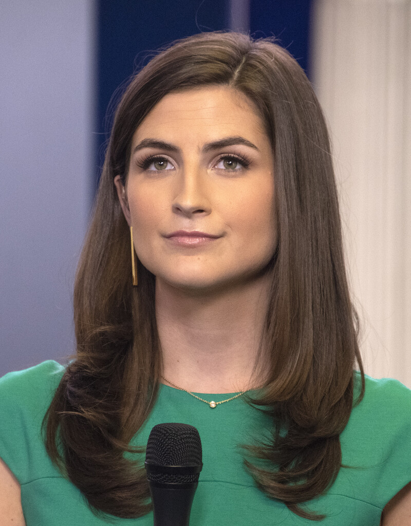 Journalist Kaitlan Collins speaks into a microphone