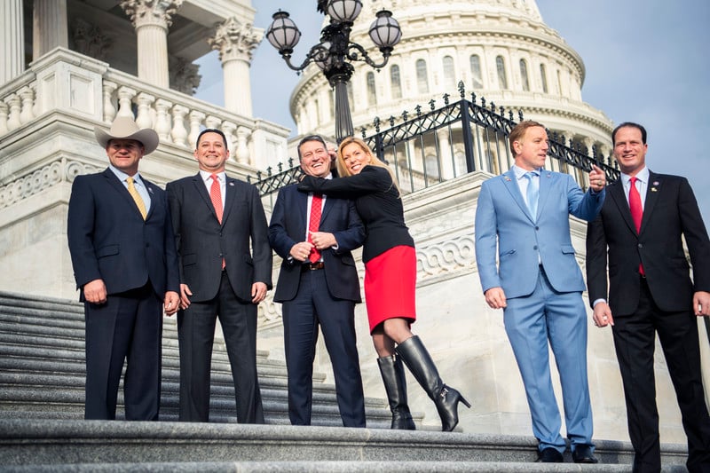 Six members of Congress stand on the House steps of the US Capitol Building
