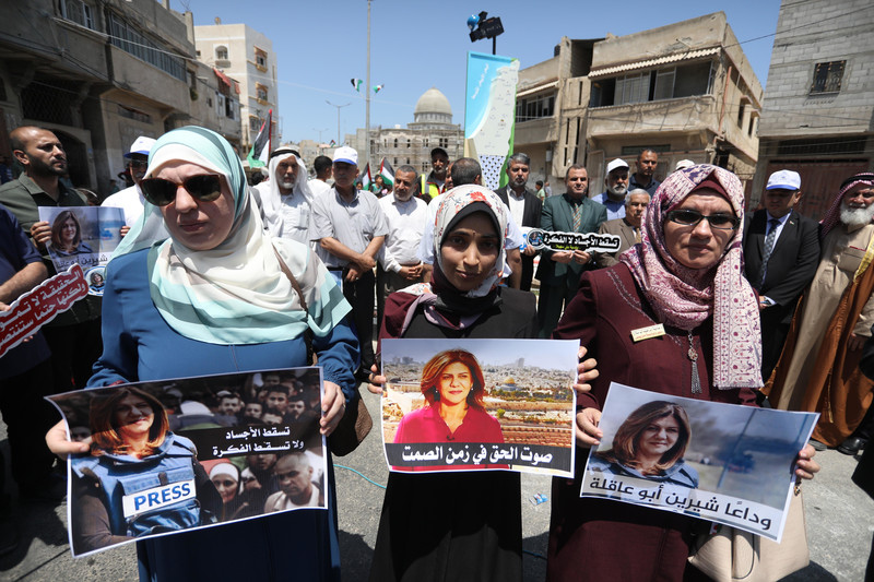 Palestinians attend the opening of Shireen Abu Akleh Square in Khan Younis, in the southern Gaza Strip, on 6 June. The square is named for the veteran Al Jazeera journalist who was shot dead by Israeli troops as she covered a raid in Jenin in May. (Ashraf Amra/ APA images)