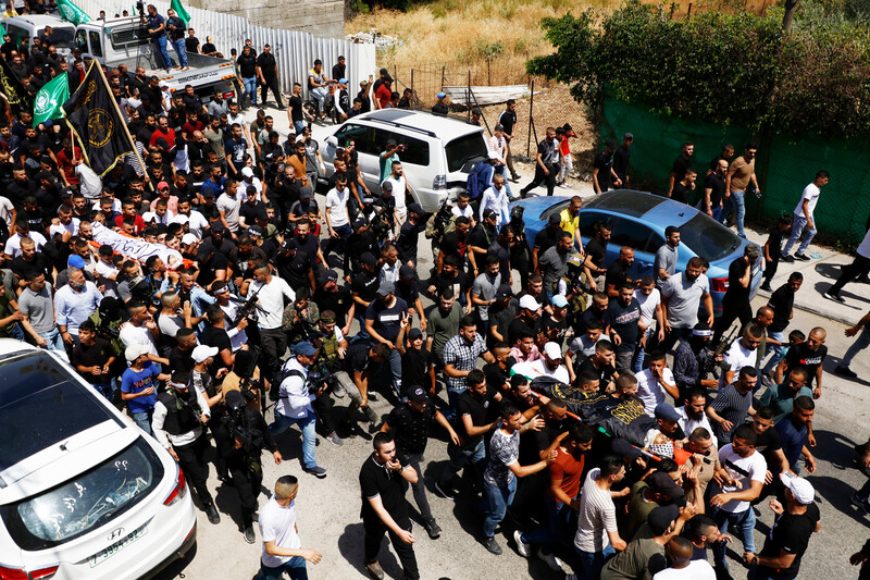 Mourners attend the funeral of three Palestinians killed during an extrajudicial execution operation in the northern West Bank city of Jenin on 17 June.  (Ahmed Ibrahim/ APA images)