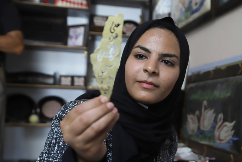 Palestinian artist Salsabil Hasouna, 23, makes decorative objects from precious metals at her Gaza City home on 26 June. Hasouna studied nursing to help herself and her family. After 15 decades of siege, unemployment rates in Gaza are among the highest in the world, with youth unemployment between the ages of 15-29 standing at 62.5 percent.  (Omar Ashtawy/ APA images)
