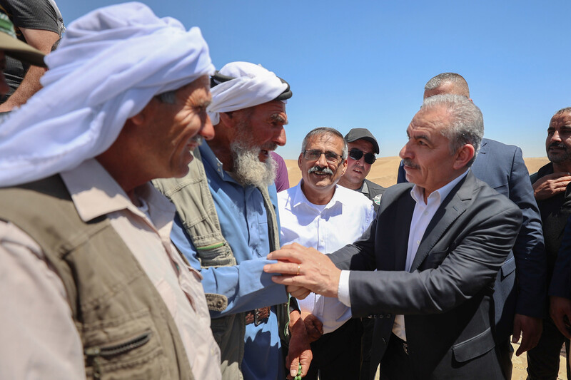 Mohammed Ishtayeh, Palestinian Authority prime minister, visits the village of Masafer Yatta, south of the West Bank city of Hebron, 26 June. Israel’s high court recently approved the forced transfer of roughly 1,000 Palestinian villagers to make way for a military training zone.  (Shadi Hatem/ APA images)