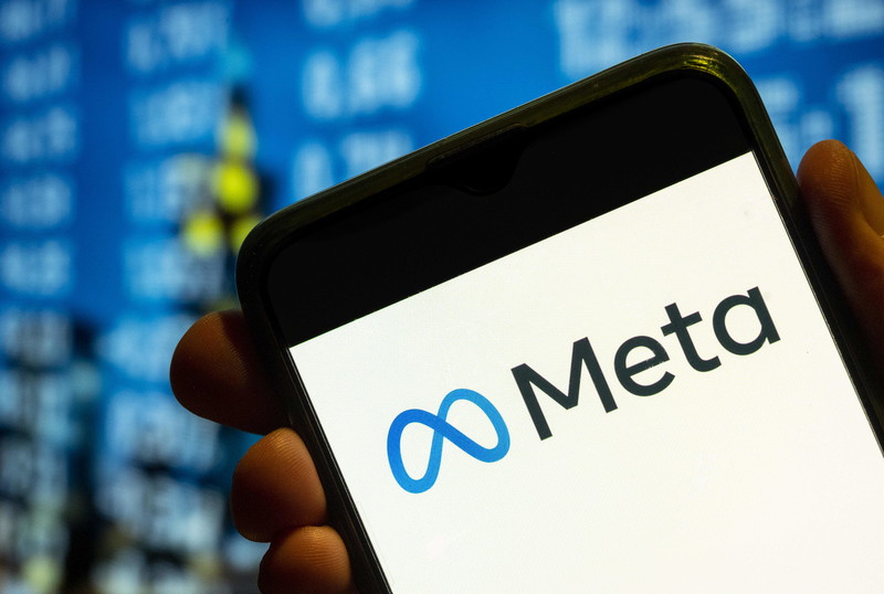 The Meta logo is seen on a mobile phone