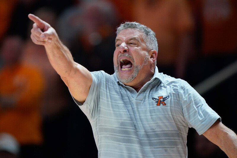 A coach points during basketball game