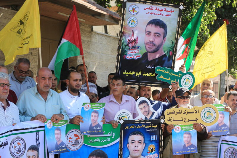People hold posters, banners and flags 