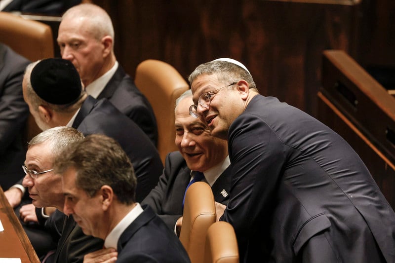 Itamar Ben-Gvir and Benjamin Netanyahu smile together in the Knesset, Israel's parliament