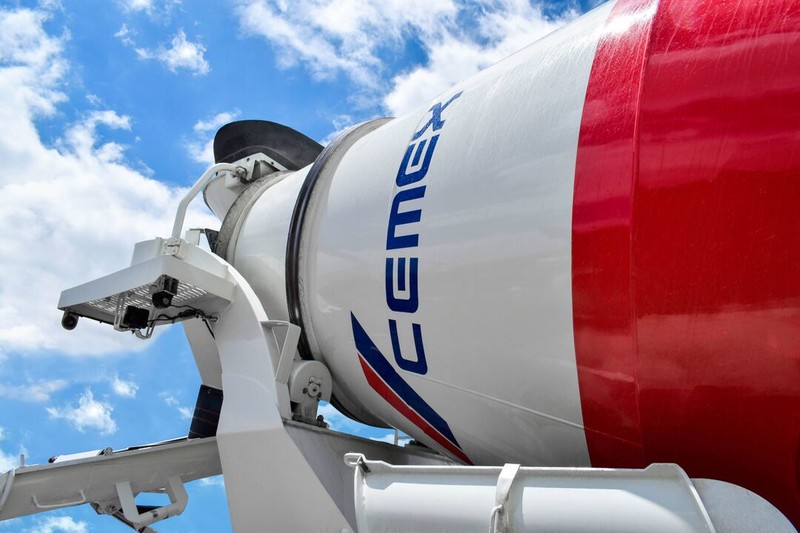 A cement truck with the logo of Cemex
