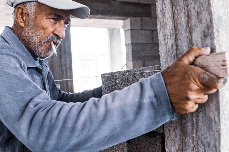 A man levels a brick