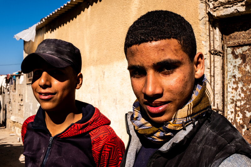 Two young men pose for the camera