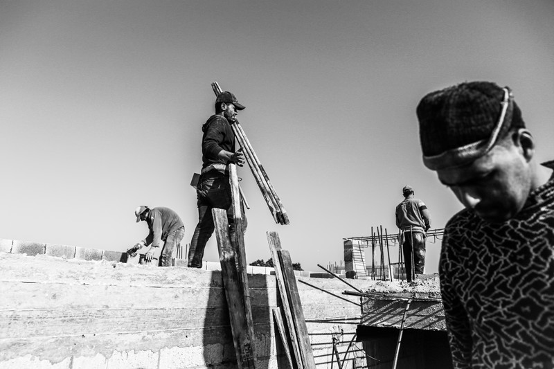 A crew of men hard at work on a construction site