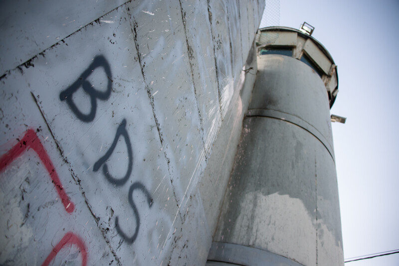 "BDS" written using spray paint on the separation wall 