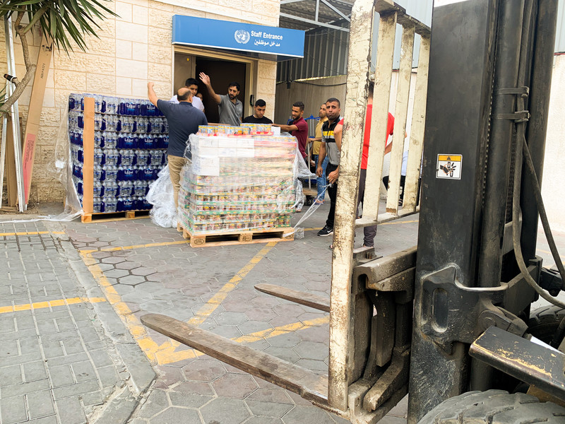 A pallet loaded with food parcels arrives at a UN building