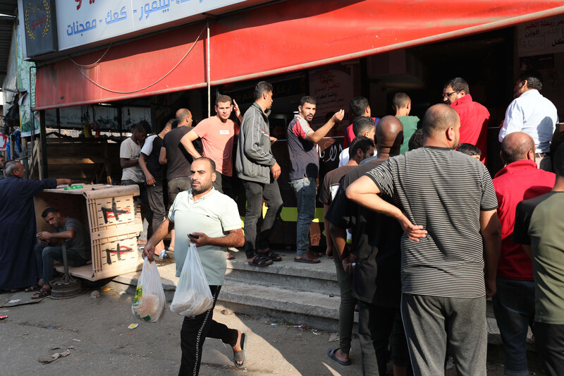 A line of people queuing for bread