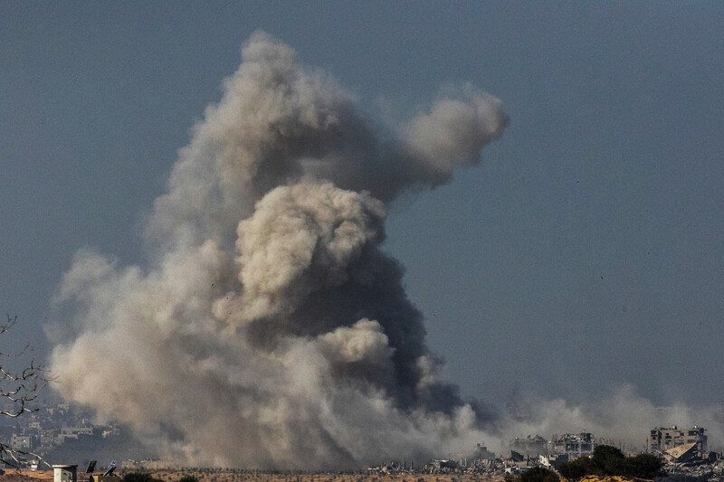 A massive plume of smoke mushrooms into the sky