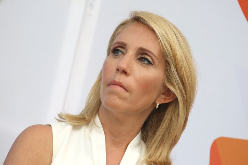 Dana Bash looks on at event