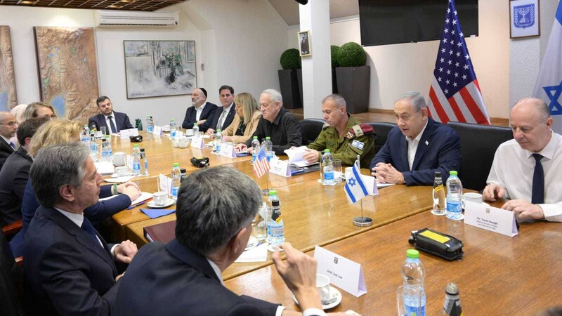 A group of men at a conference table