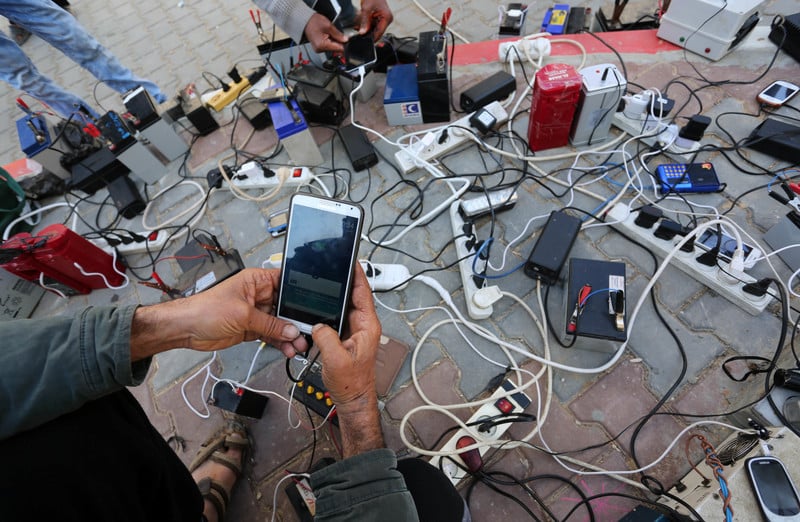 A bunch of phones being charged on a mobile battery