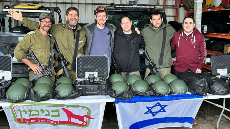 HaYovel distributes equipment to armed and uniformed settlers