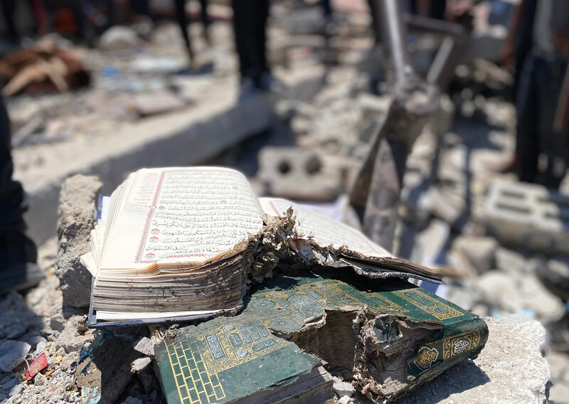 Damaged books lie in rubble