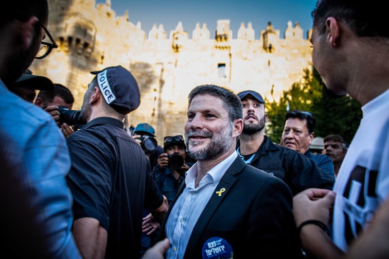 A man smiles gormlessly outside Jerusalem's Old City