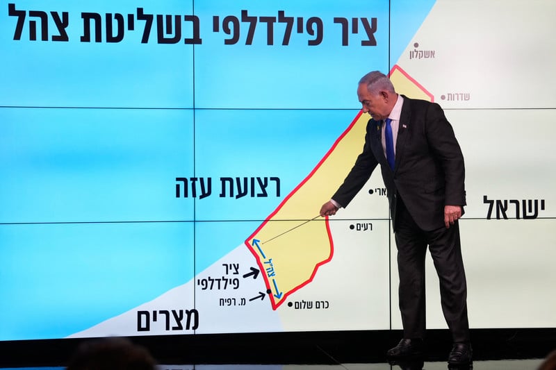 Benjamin Netanyahu with map of Gaza and Israel that erases West Bank