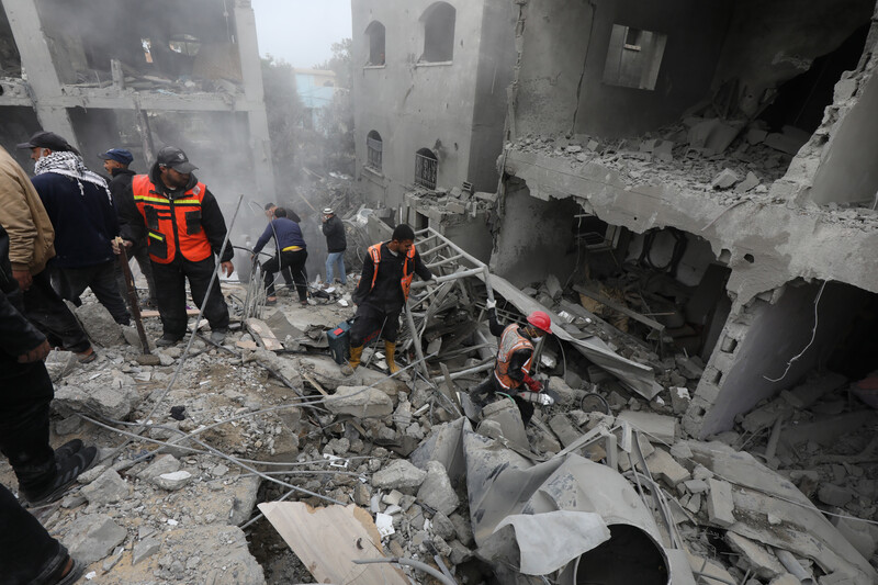 Emergency workers search rubble for survivors