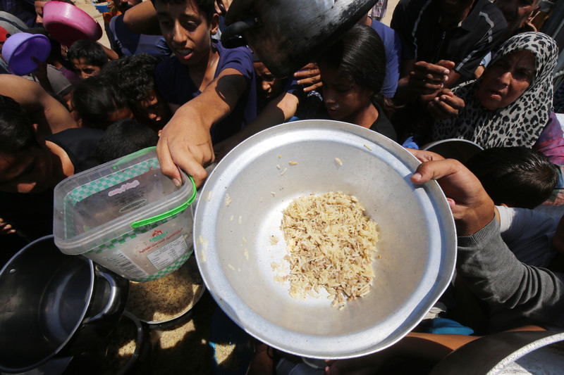 A pot with some uncooked rice